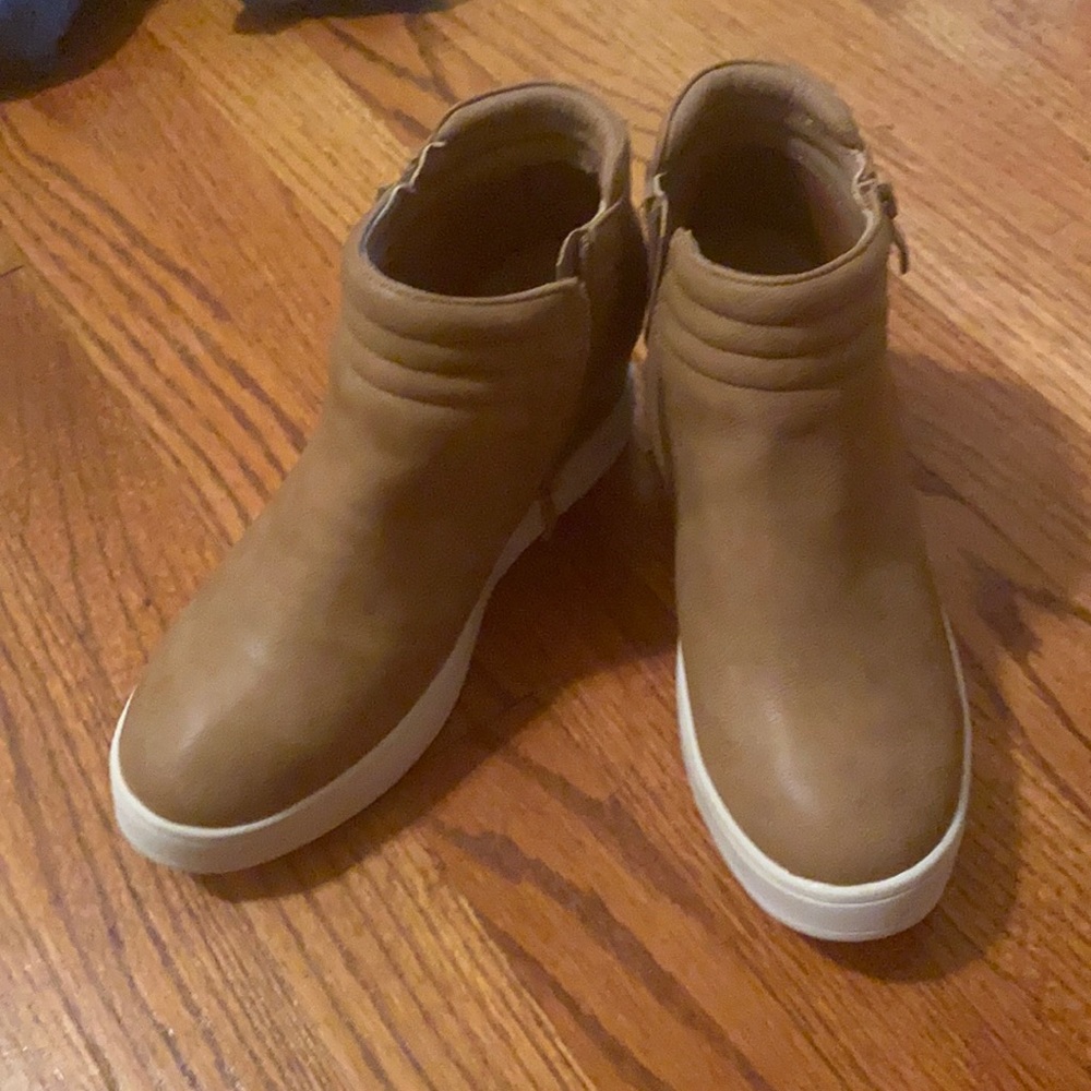 Faux leather wedge sneakers.